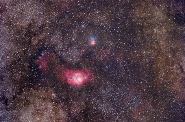 The Lagoon and Trifid Nebulae. Wide Field image taken with 200mm F/2.8 Canon telephoto.