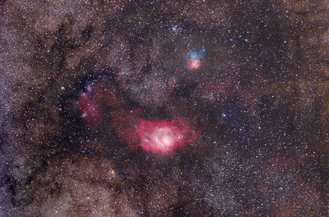 The Lagoon and Trifid Nebulae. Wide Field image taken with 200mm F/2.8 Canon telephoto.  Object-centered crop.