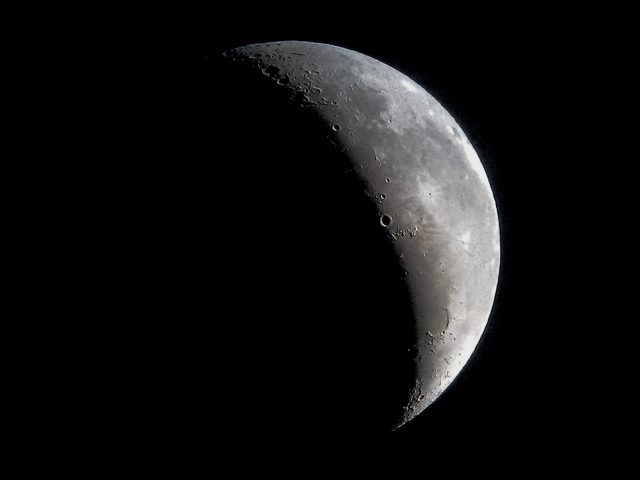 A Crescent Moon on September 25, 2016. 6 in F/8 Newtonian, 25mm Plossl, HTC 3.2 megapixel camera phone.